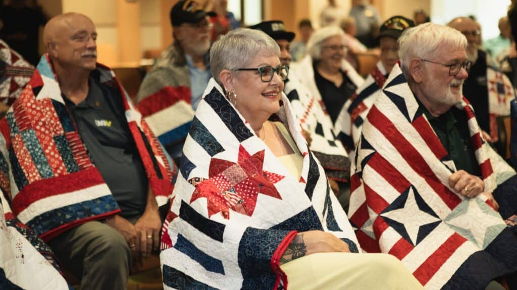 Bellevue Times » Fourteen Veterans Receive Quilts of Valor at Bellevue University » July 21, 2026